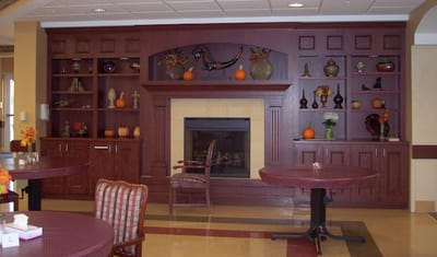 Interior common area with decorative shelving and seating