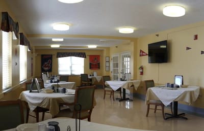 Dining area with tables set for residents