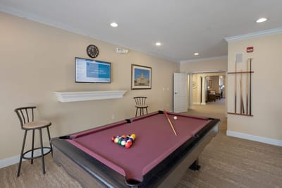 Interior view of a game room with a pool table
