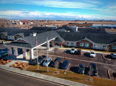 Aerial view of the senior living facility exterior with parking area