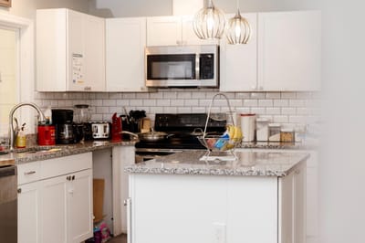 Modern kitchen interior with granite countertops and appliances