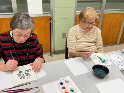 Residents painting during an activity session