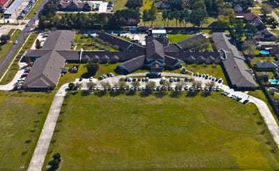 Aerial view of the Maison De Lafayette facility with landscaped grounds