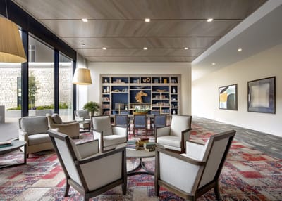 Common area with seating and bookshelves