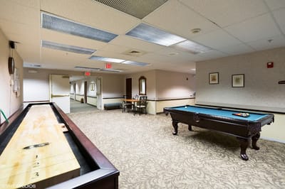 Interior common area with a pool table and seating