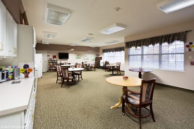 Bright common area with tables and chairs