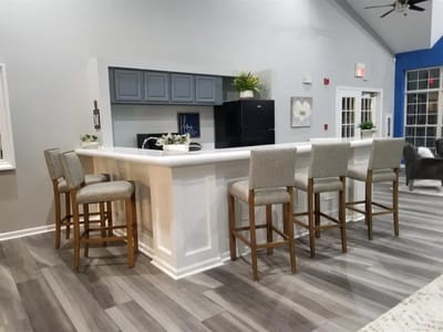 Bright common area with a bar and seating