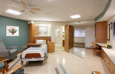 Private resident room with bed and seating area