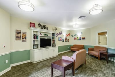 Common area with seating and decorations on the wall