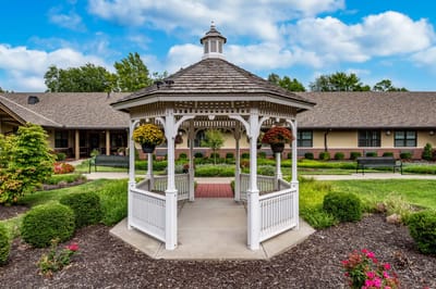 A gazebo surrounded by landscaped gardens