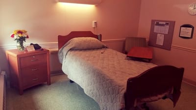 Cozy private room with a bed and dresser