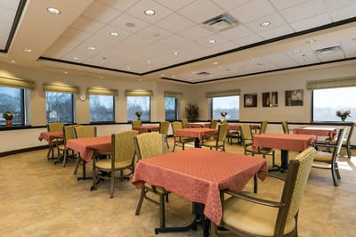 Bright dining area with tables and chairs