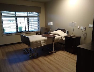 Private room with a bed and window
