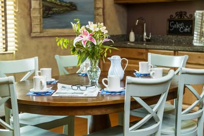 Dining area with flowers and coffee cups