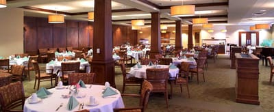 Dining area with tables set for a meal