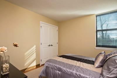 Cozy bedroom with natural light in a senior apartment
