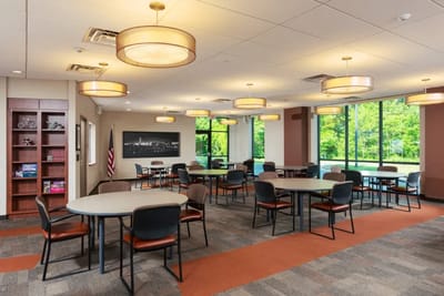 Bright common area with tables and chairs