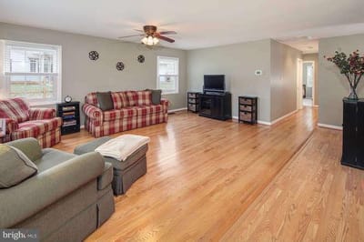 Bright common area with seating and television