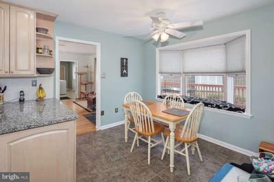 Bright kitchen area with dining table and chairs