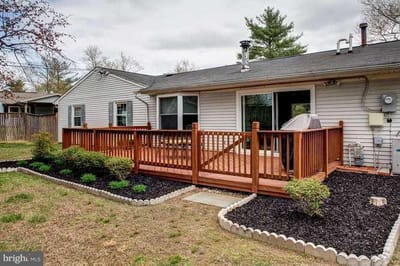Outdoor deck area with landscaped yard