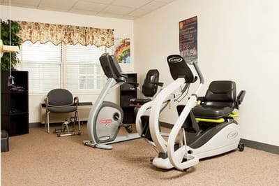 Well-equipped fitness room with exercise bikes