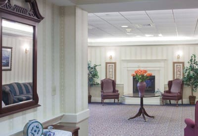 Common area with seating and fireplace