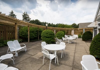Outdoor seating area with tables and chairs