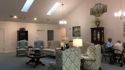 Common area with seating and residents socializing