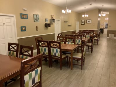 Dining area with wooden tables and chairs
