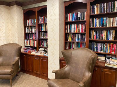 Interior view of a cozy reading area with bookshelves
