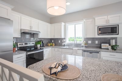 Bright kitchen area with modern appliances and decor