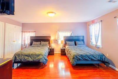 Comfortable resident room with two beds and decor