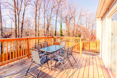 Outdoor patio with seating overlooking trees