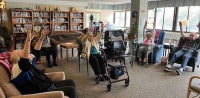 Residents engaged in an activity session in a common area