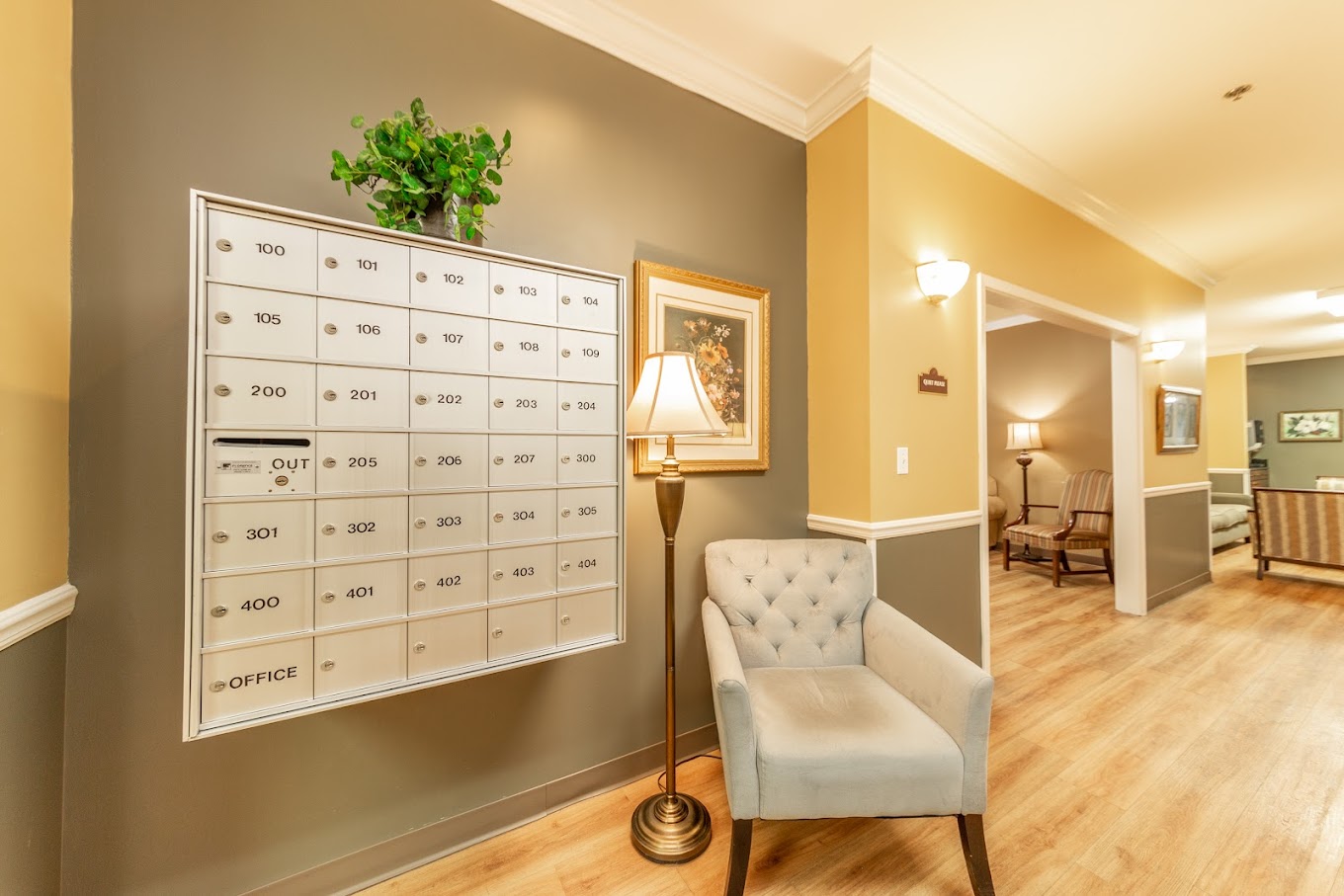 Interior view of a common area with mailboxes and seating