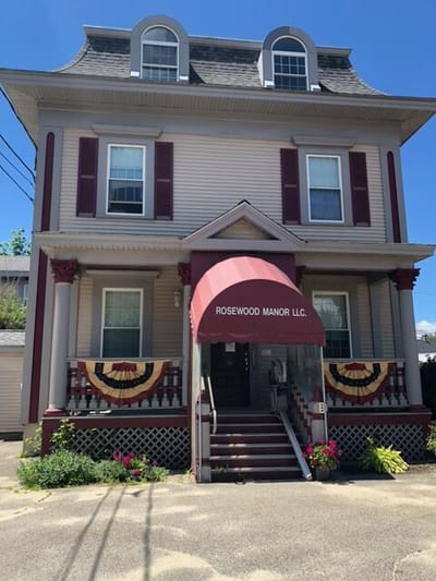 Exterior view of Rosewood Manor LLC with decorative elements