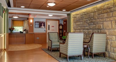 Bright lobby area with seating and reception desk