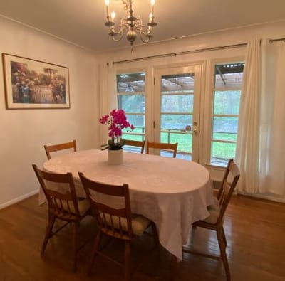 Dining area with a table and chairs, natural light