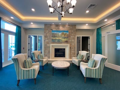 Bright common area with seating and fireplace