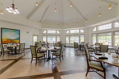 Bright and spacious dining area with tables and chairs