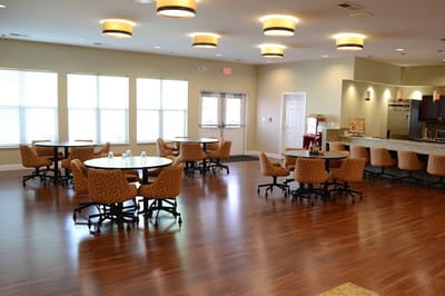 Bright common area with tables and chairs