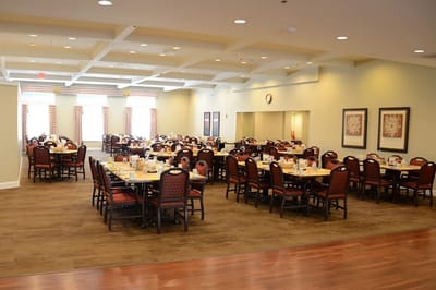 Dining room with tables set for breakfast