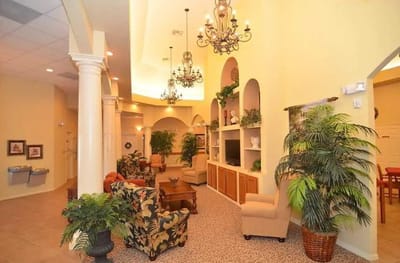 Interior view of a welcoming common area with plants and seating