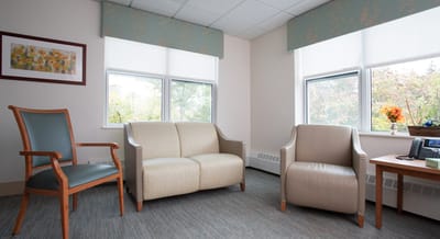 Cozy interior of a private resident room with seating