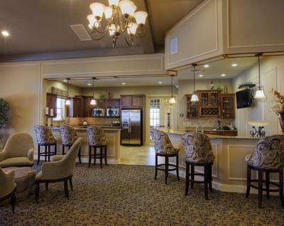 Bright common area with seating and kitchen
