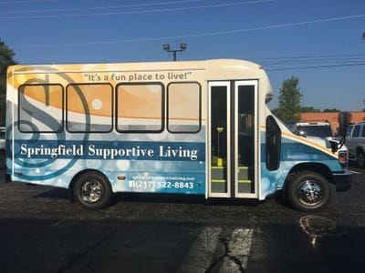 Facility shuttle bus with branding
