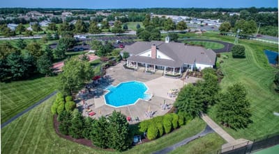 Aerial view of a facility with pool and landscaped grounds