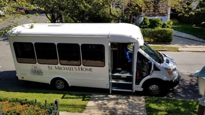 Facility shuttle bus parked outside