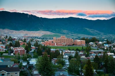 Aerial view of St. James Healthcare facility surrounded by mountains