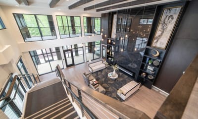 Bright and modern lobby area with seating and art